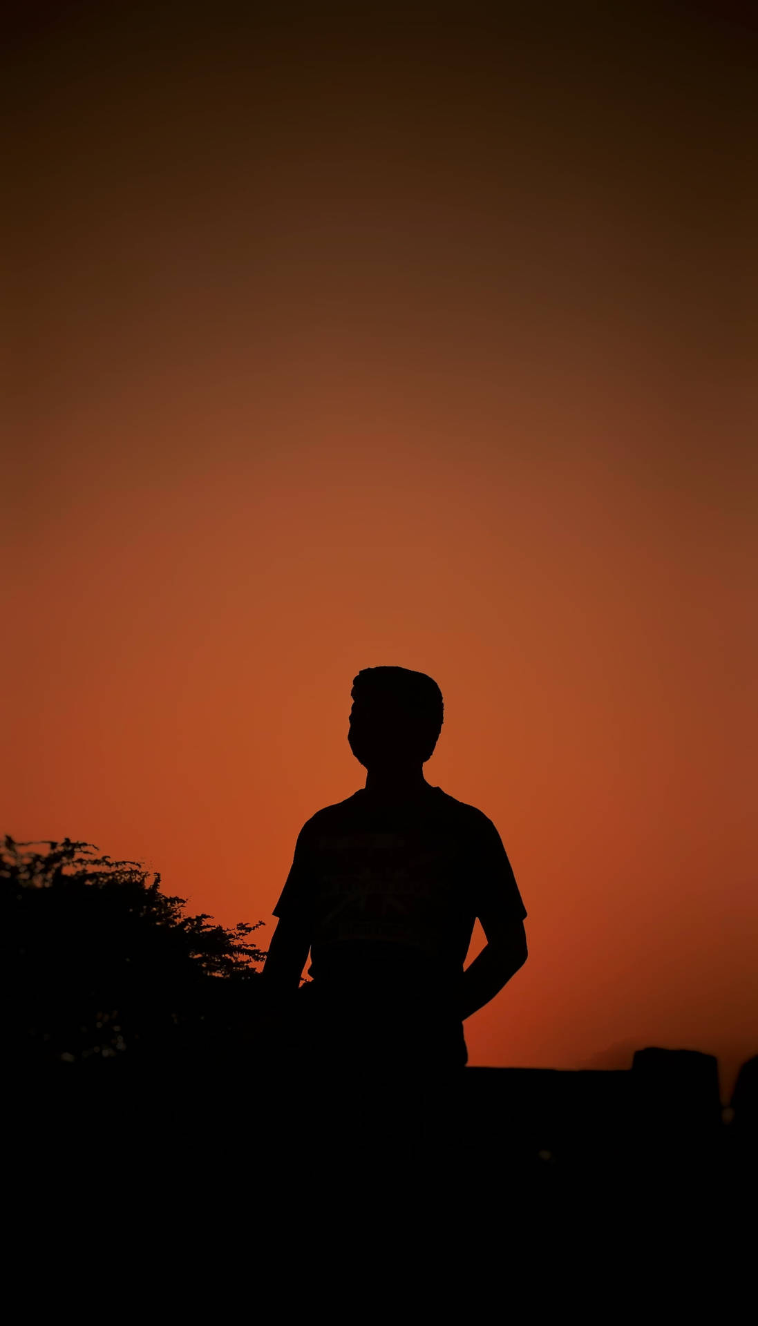 Boy Shadow On An Orange Sunset Sky