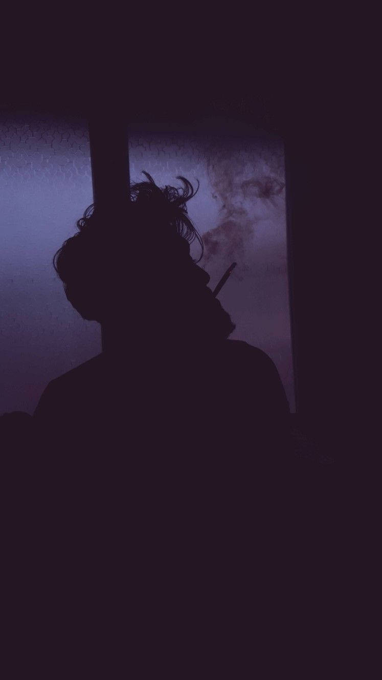 Intriguing Teenage Rebellion - Young Boy Engulfed in Smoke Wallpaper
