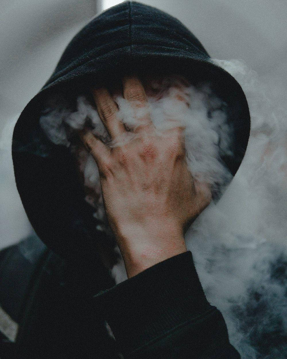 Boy Smoke With Hand On Face Wallpaper