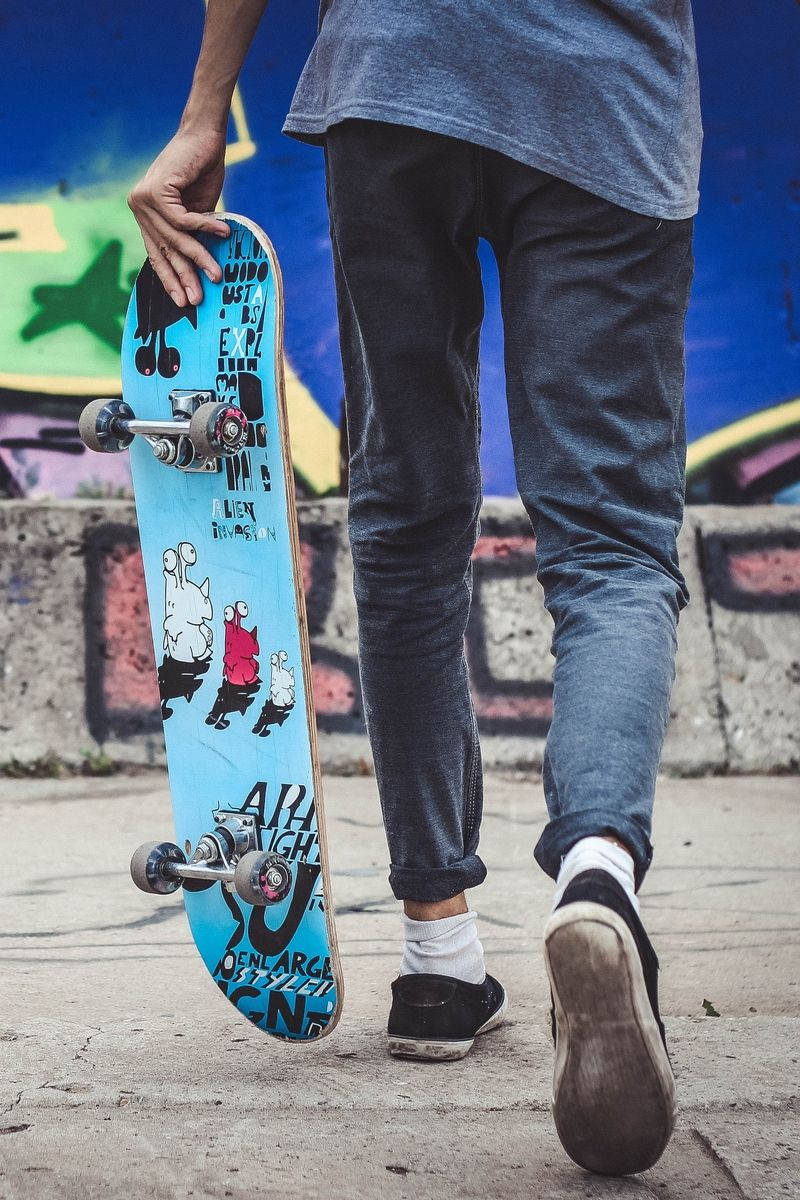 Boy Walking With Skateboard Iphone Wallpaper