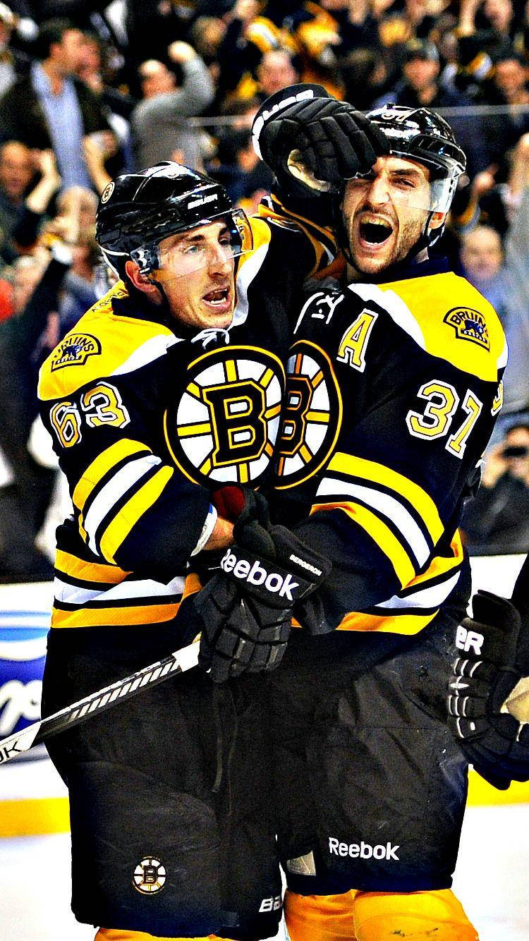 Brad Marchand Celebrating With Patrice Bergeron Wallpaper