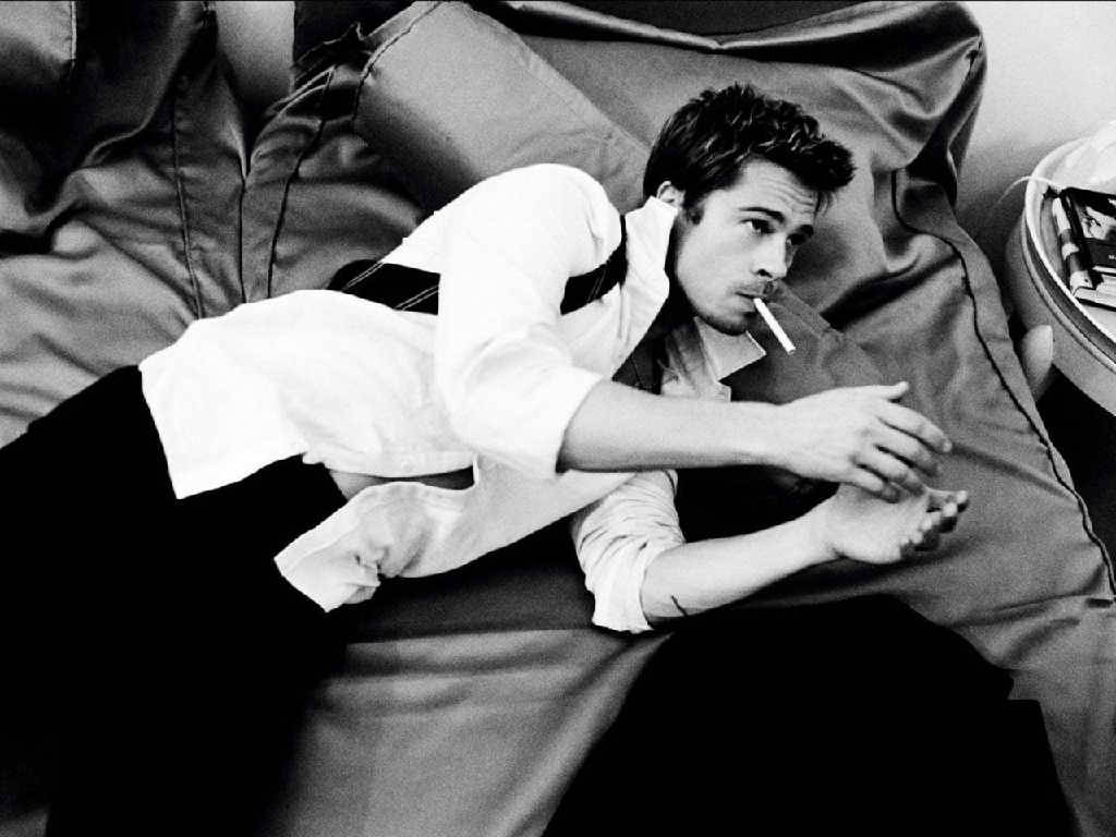 Brad Pitt lounging in bed Wallpaper