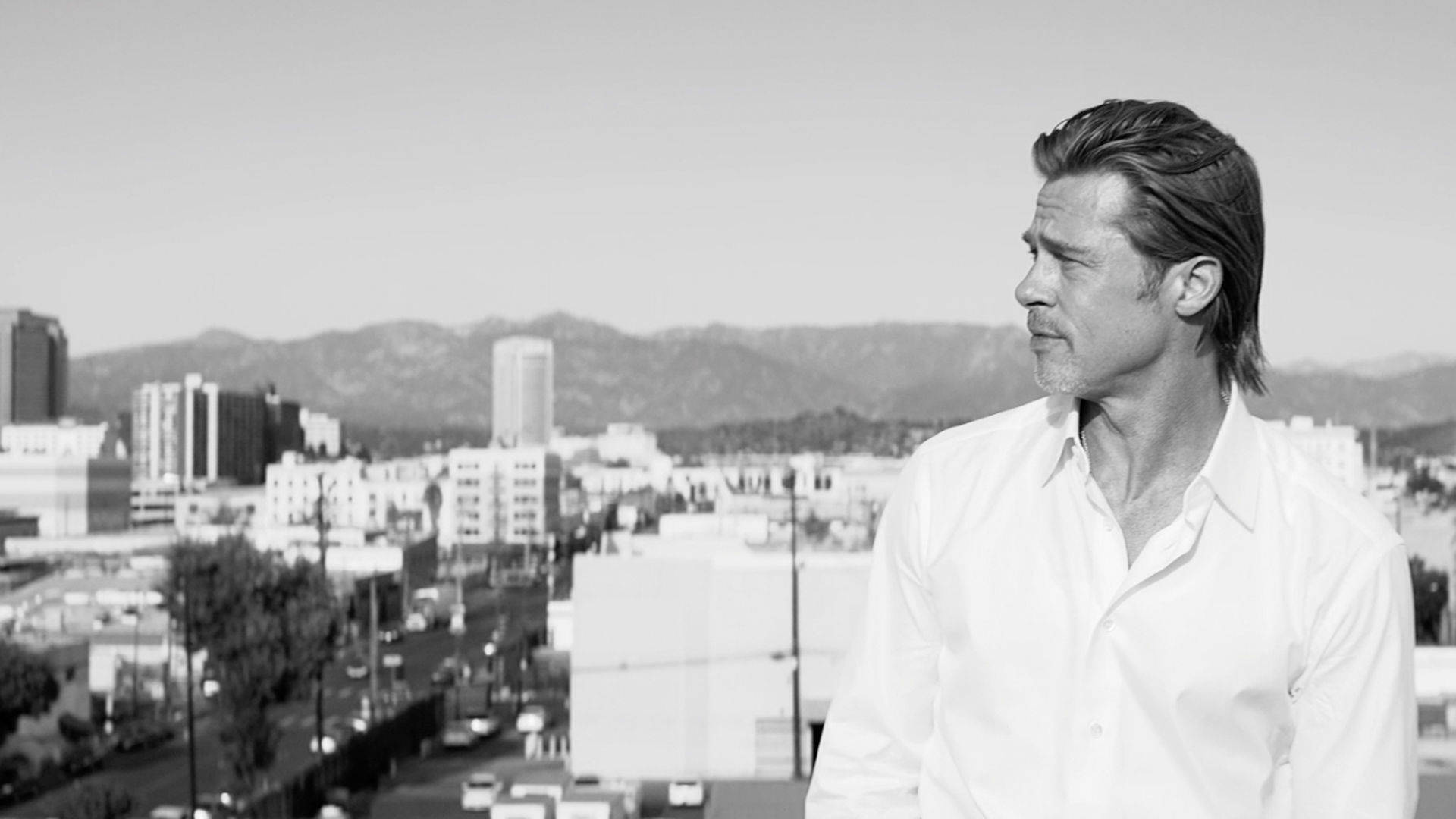 Brad Pitt Wearing A Brioni Polo Wallpaper