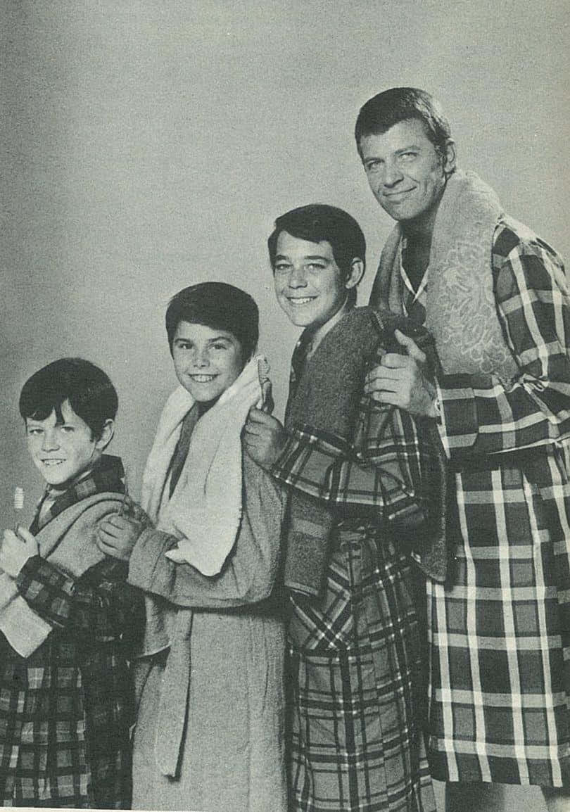 A Group Of Boys In Plaid Robes