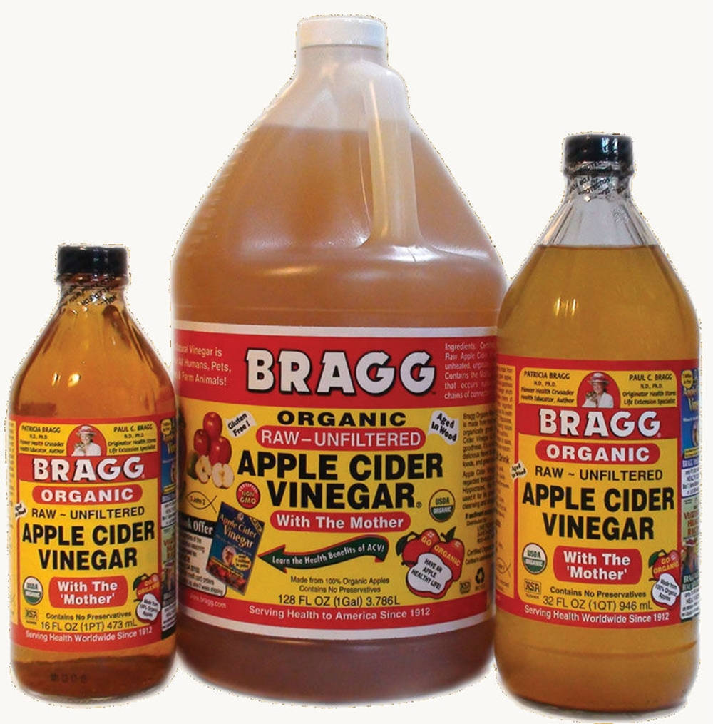 Bragg Apple Cider Vinegar In Large Quantity Background