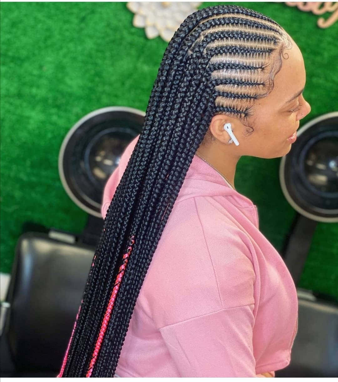 Download A Woman With Braids In Her Hair | Wallpapers.com