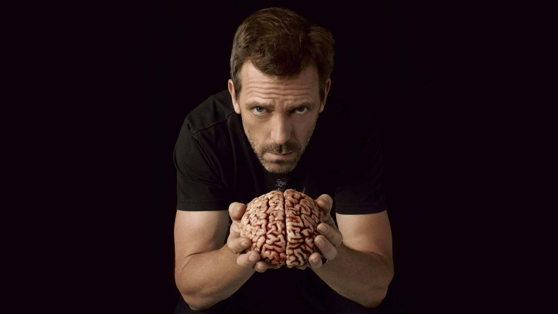 A Man Holding A Brain With His Hands Wallpaper