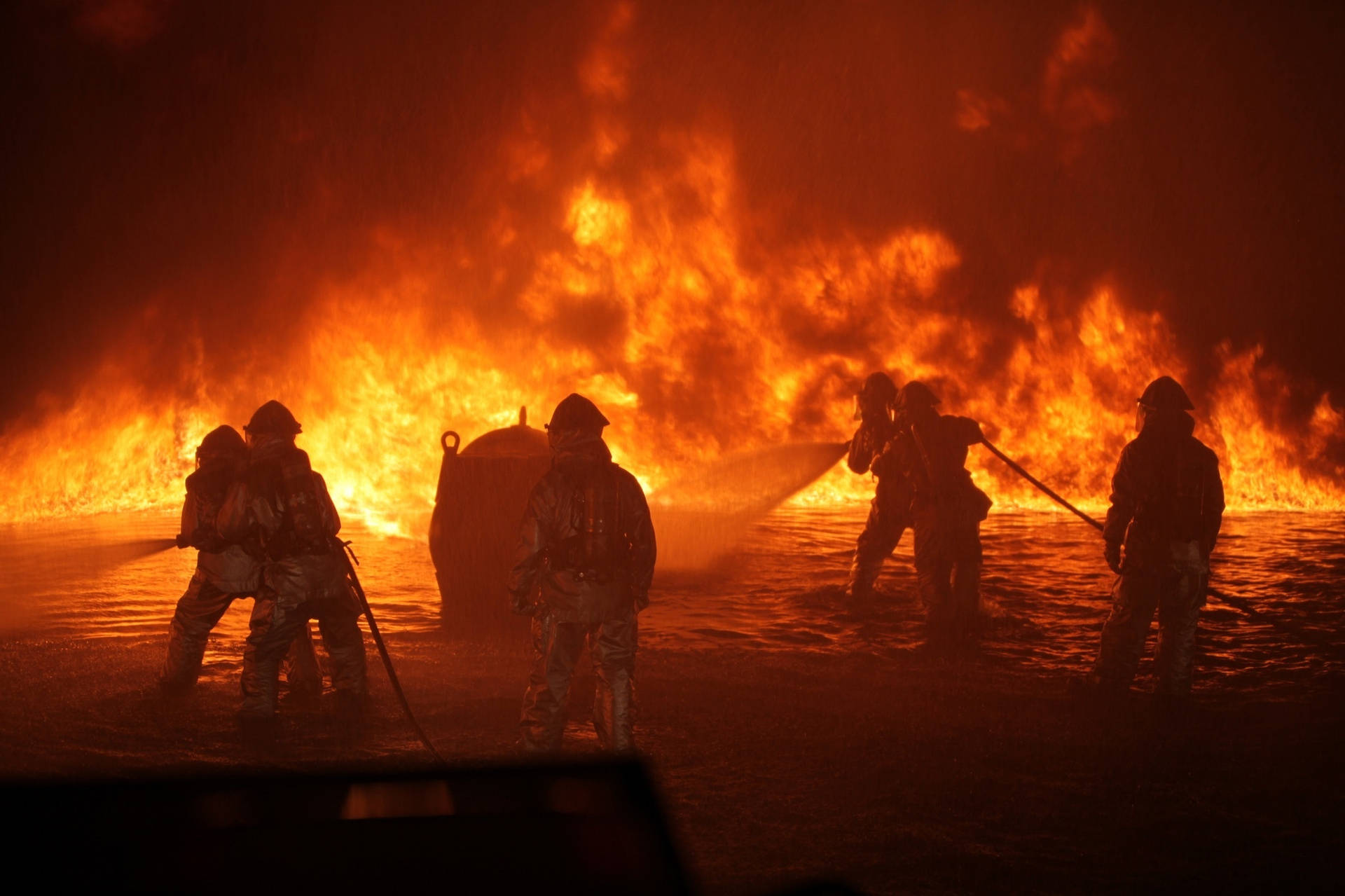 Brave Firefighters Battling Inferno Wallpaper