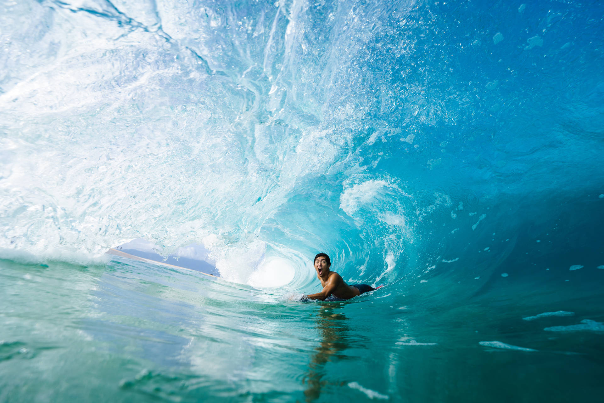 Brave Surfer In Waves Wallpaper