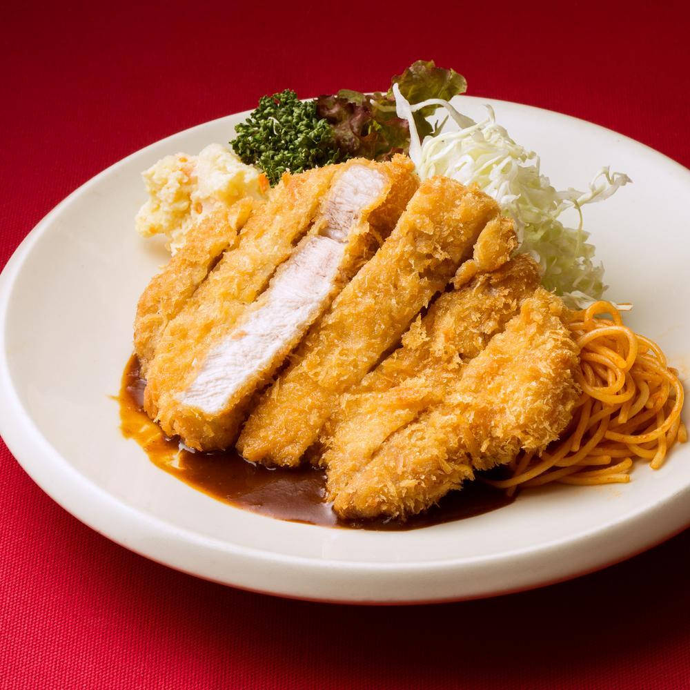 Breaded Tonkatsu With Pasta On A White Plate Wallpaper