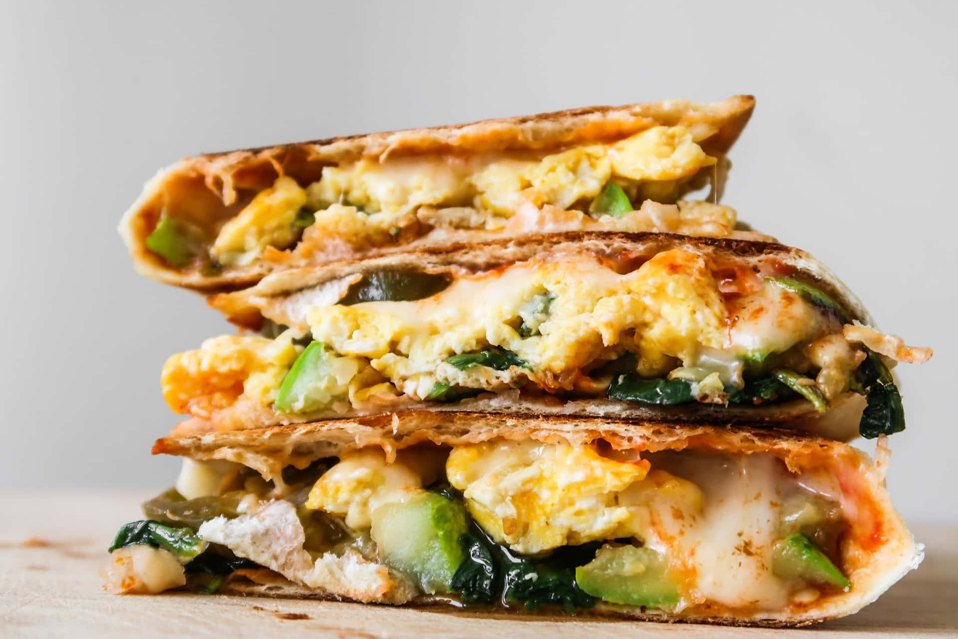 A Stack Of Grilled Sandwiches With Spinach And Eggs