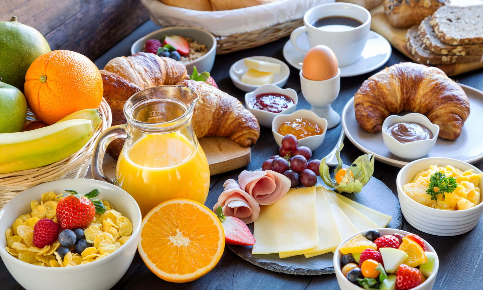 breakfast with fruit, croissants, orange juice and juice