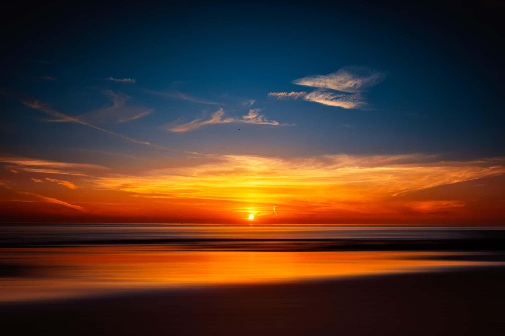 Breath-taking 4k Sunset Over A Tranquil Coastline Wallpaper