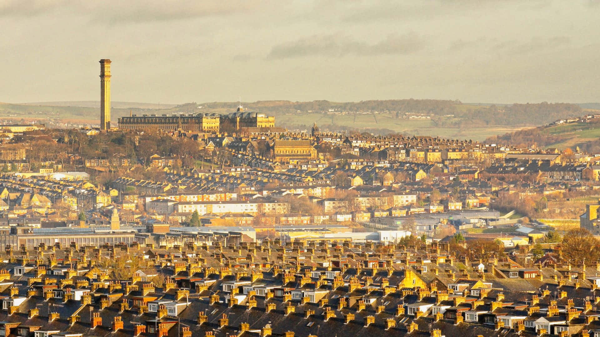 Breathtaking Skyline View Of Bradford, United Kingdom At Sunset. Wallpaper