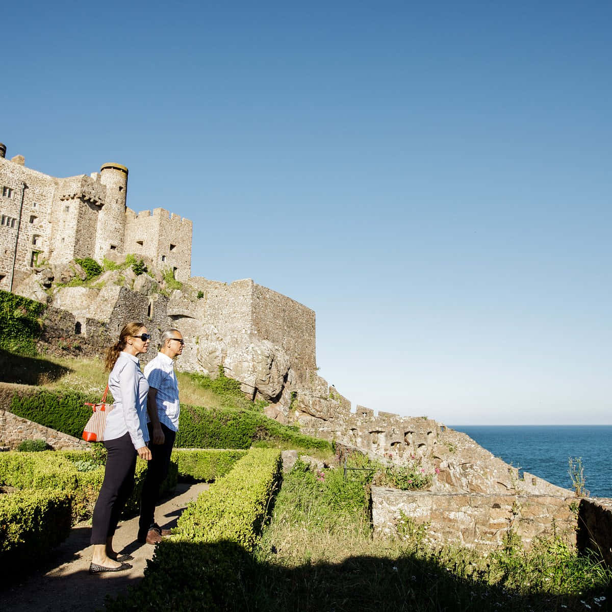 Breathtaking Sunfall On The Iconic Mont Orgueil Castle In Jersey Wallpaper
