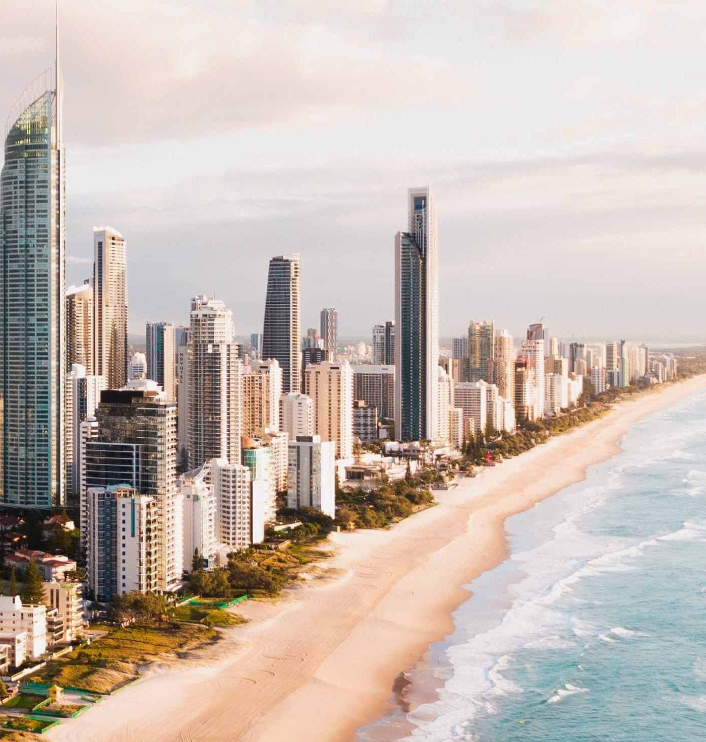 Breathtaking Sunrise Illuminating The Gold Coast Skyline. Wallpaper