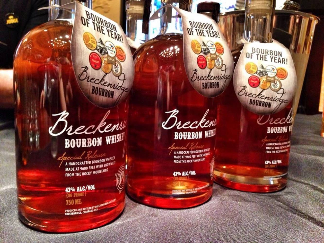 Caption: Award-winning Breckenridge Distillery bourbon bottle showcased against a stunning backdrop. Wallpaper