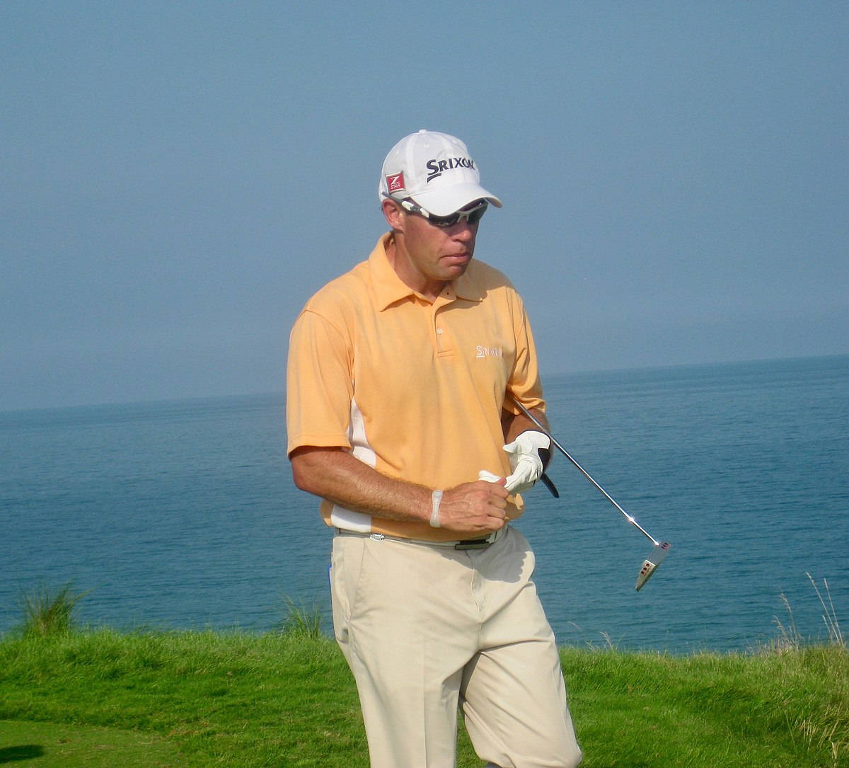 Brian Davis Playing Golf Beside A Lake Wallpaper