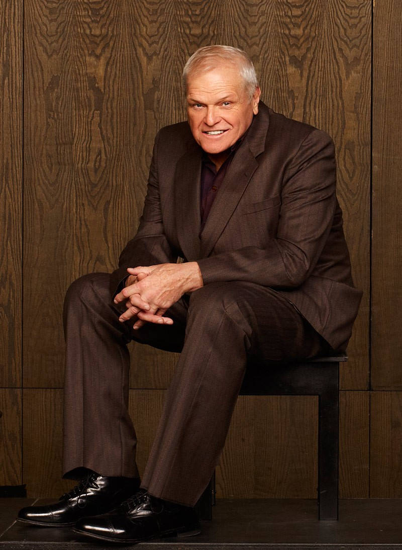 Brian Dennehy Brown Aesthetic Suit Wooden Background Wallpaper