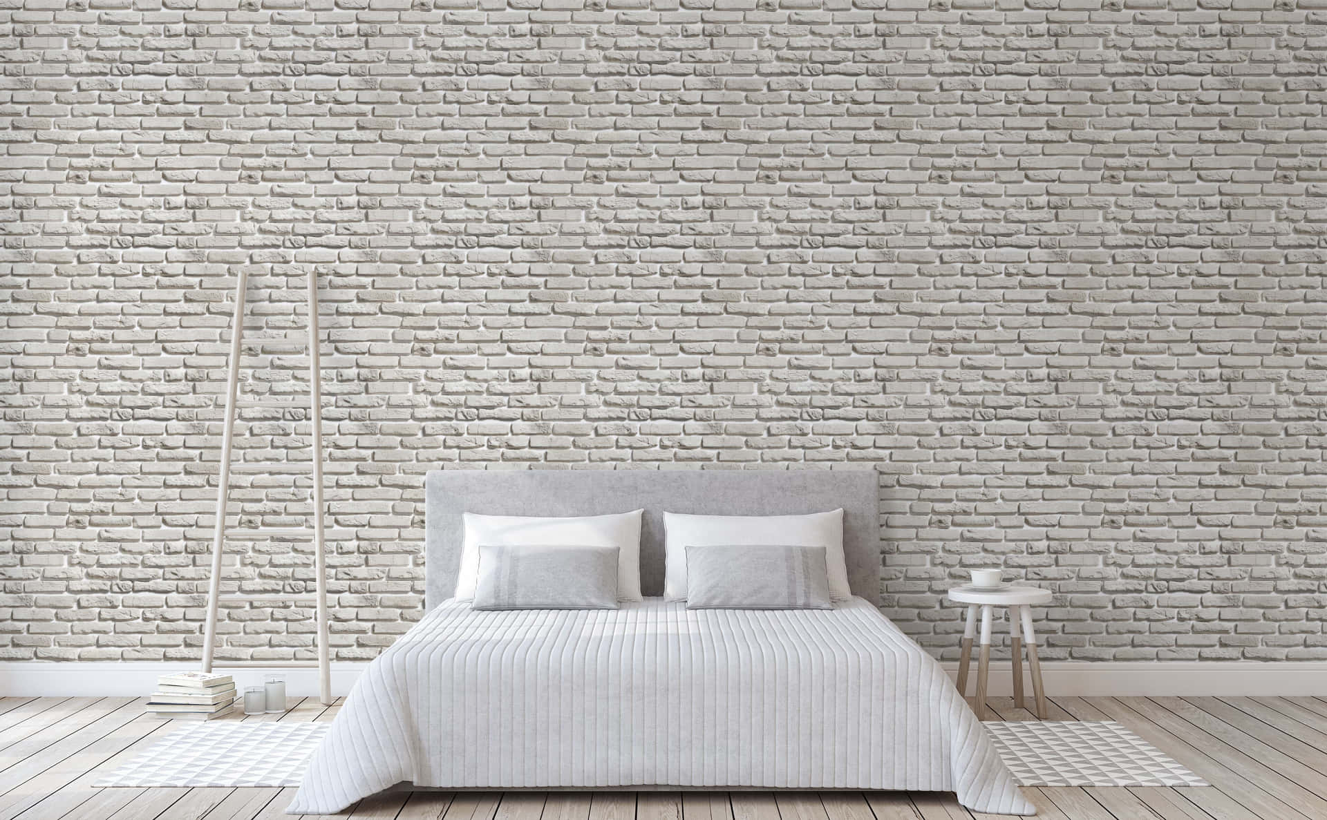 A Bedroom With A White Bed And Brick Wall