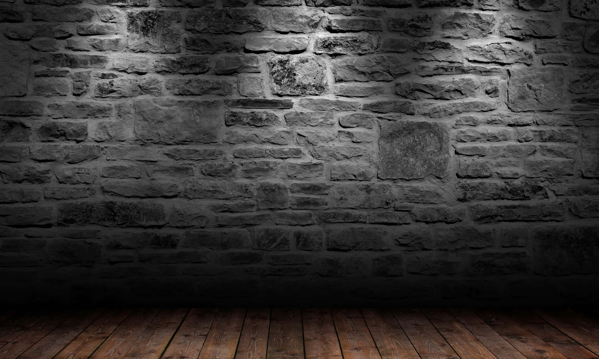 An Empty Room With A Stone Wall And Wooden Floor