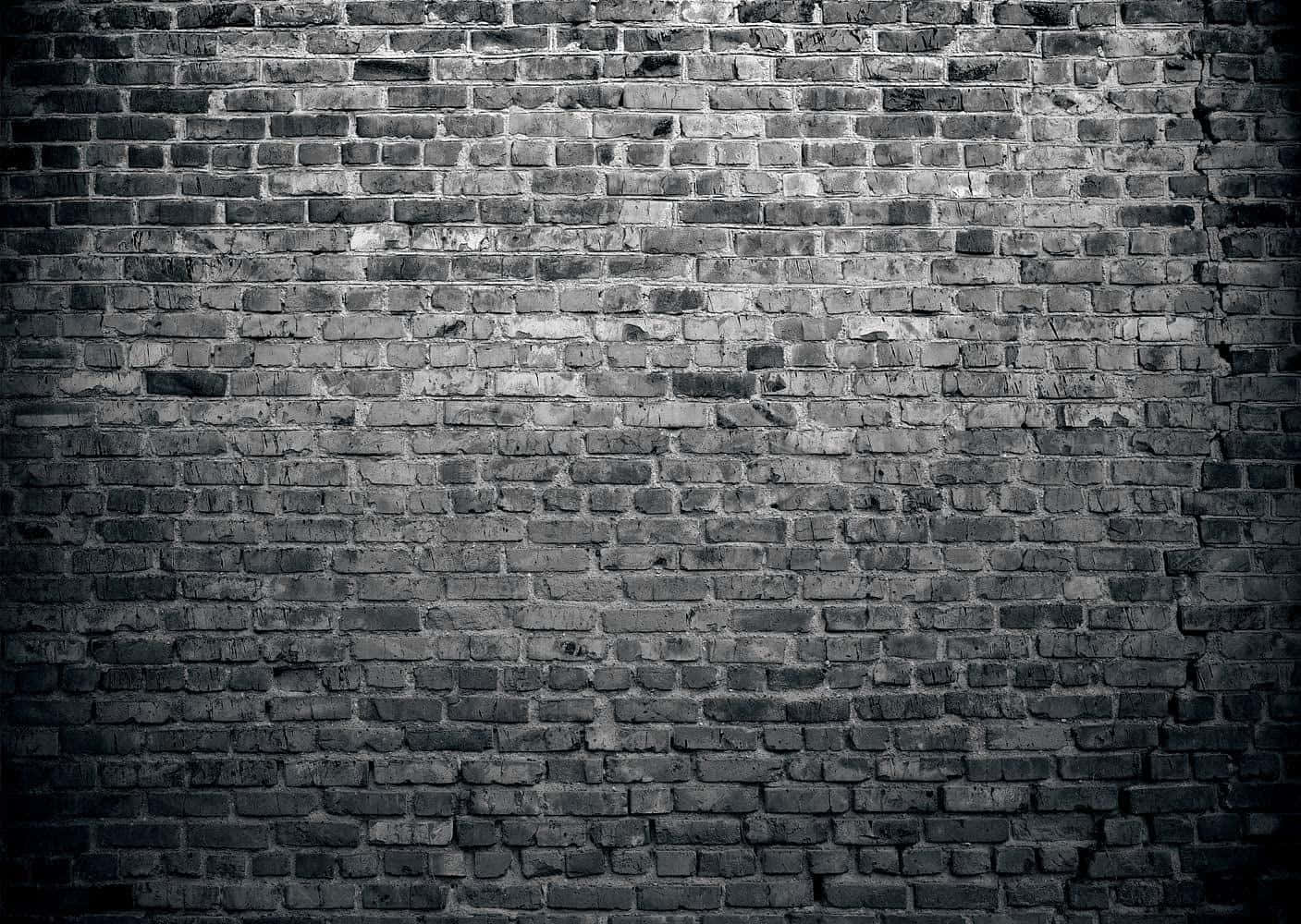 Unafoto In Bianco E Nero Di Un Muro Di Mattoni