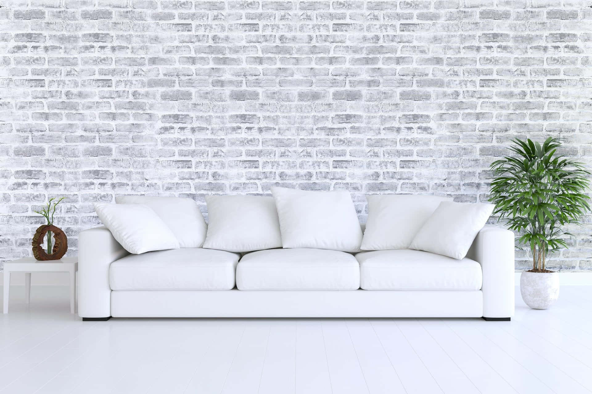 White Couch In Front Of A Brick Wall