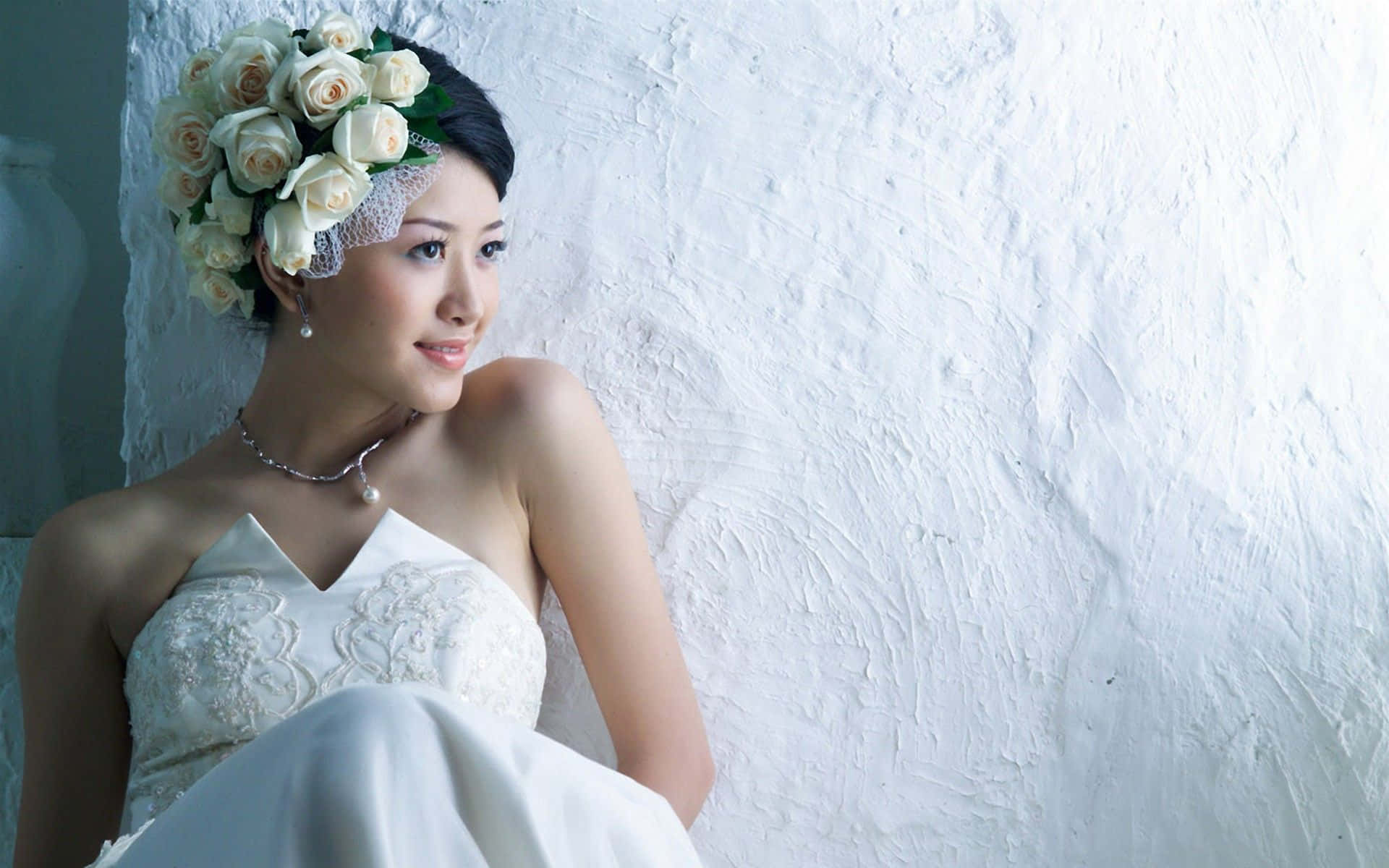 Elegant Bride in Stunning Gown and Floral Wreath