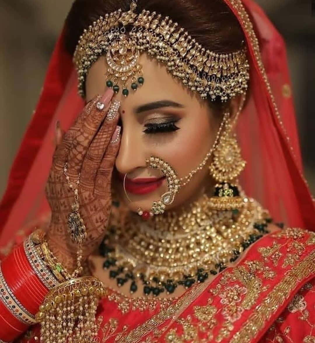 A Bride In Red And Gold Jewelry