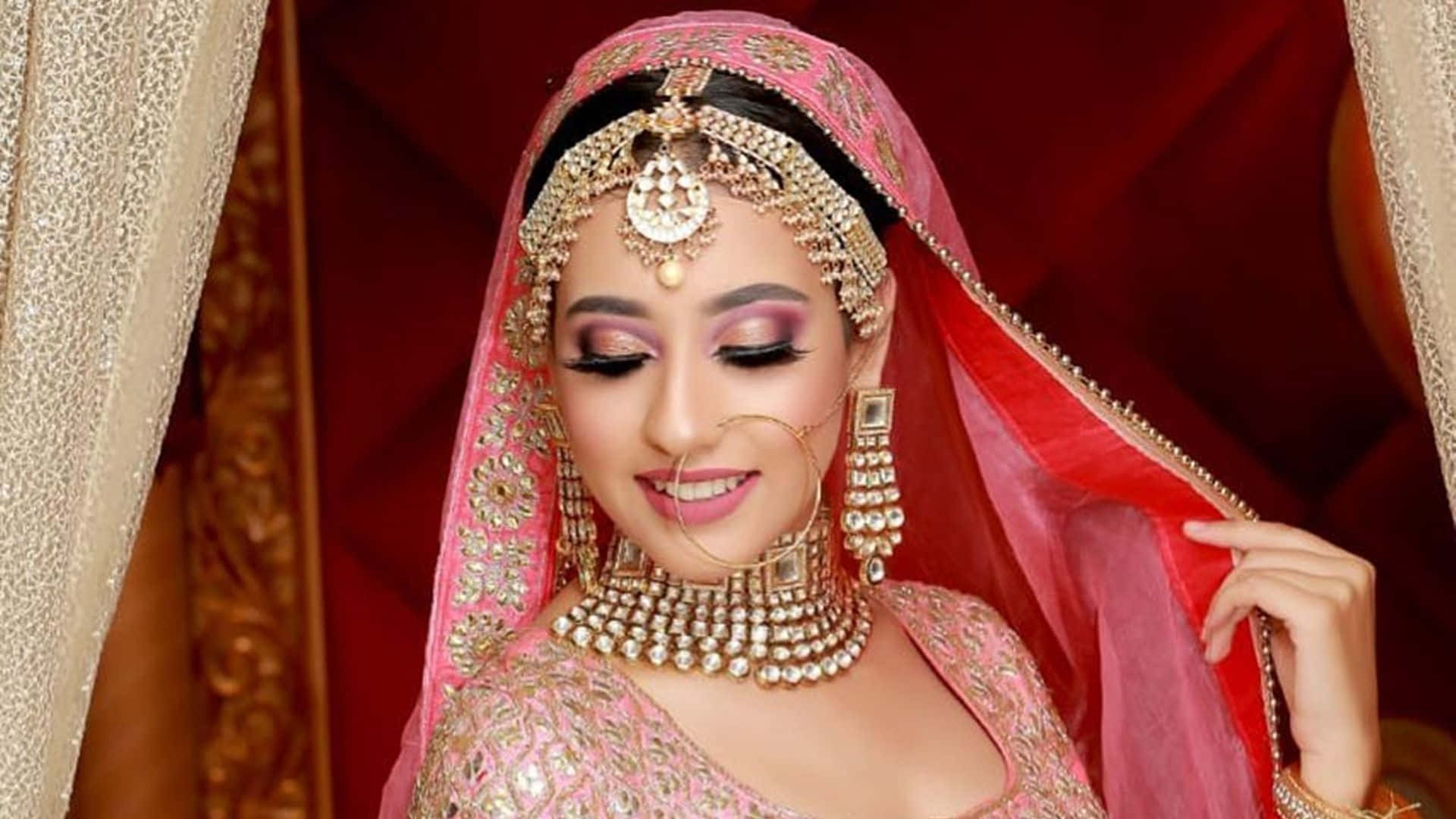 A Beautiful Bride In Pink And Gold Jewelry