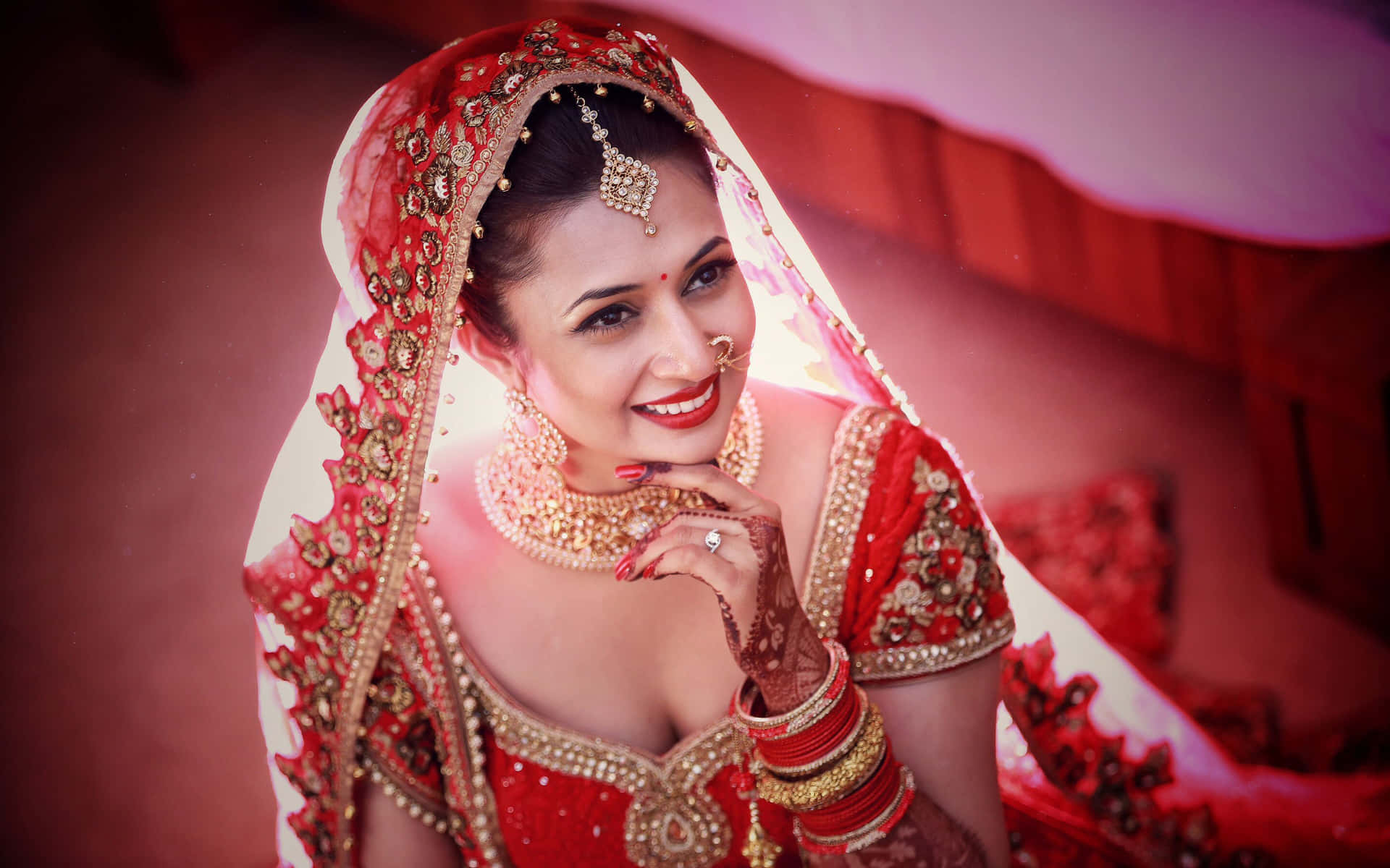 A Bride In Red And Gold In A Bed