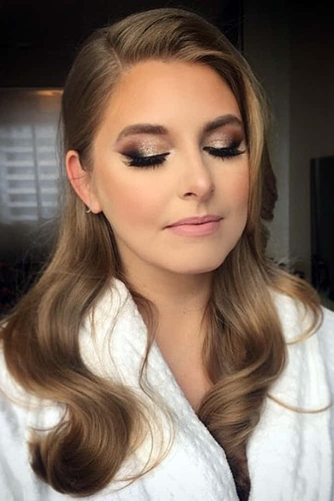 A Beautiful Woman In A Robe With Makeup On