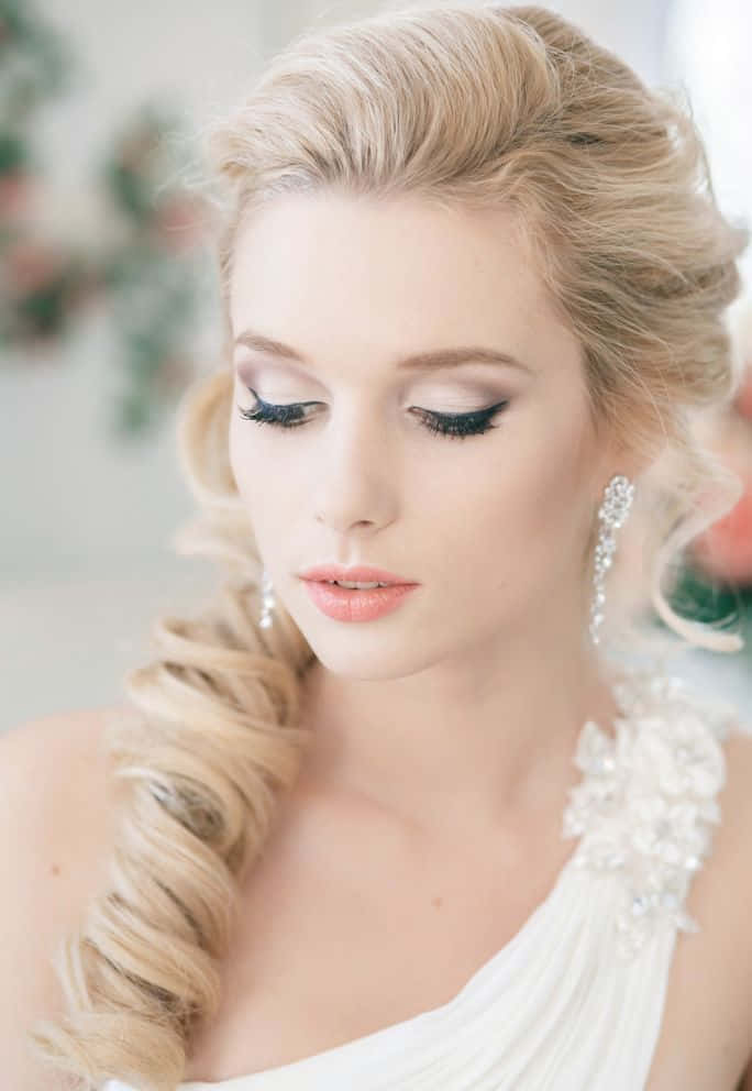 A Beautiful Bride With Long Blonde Hair And A Wedding Dress