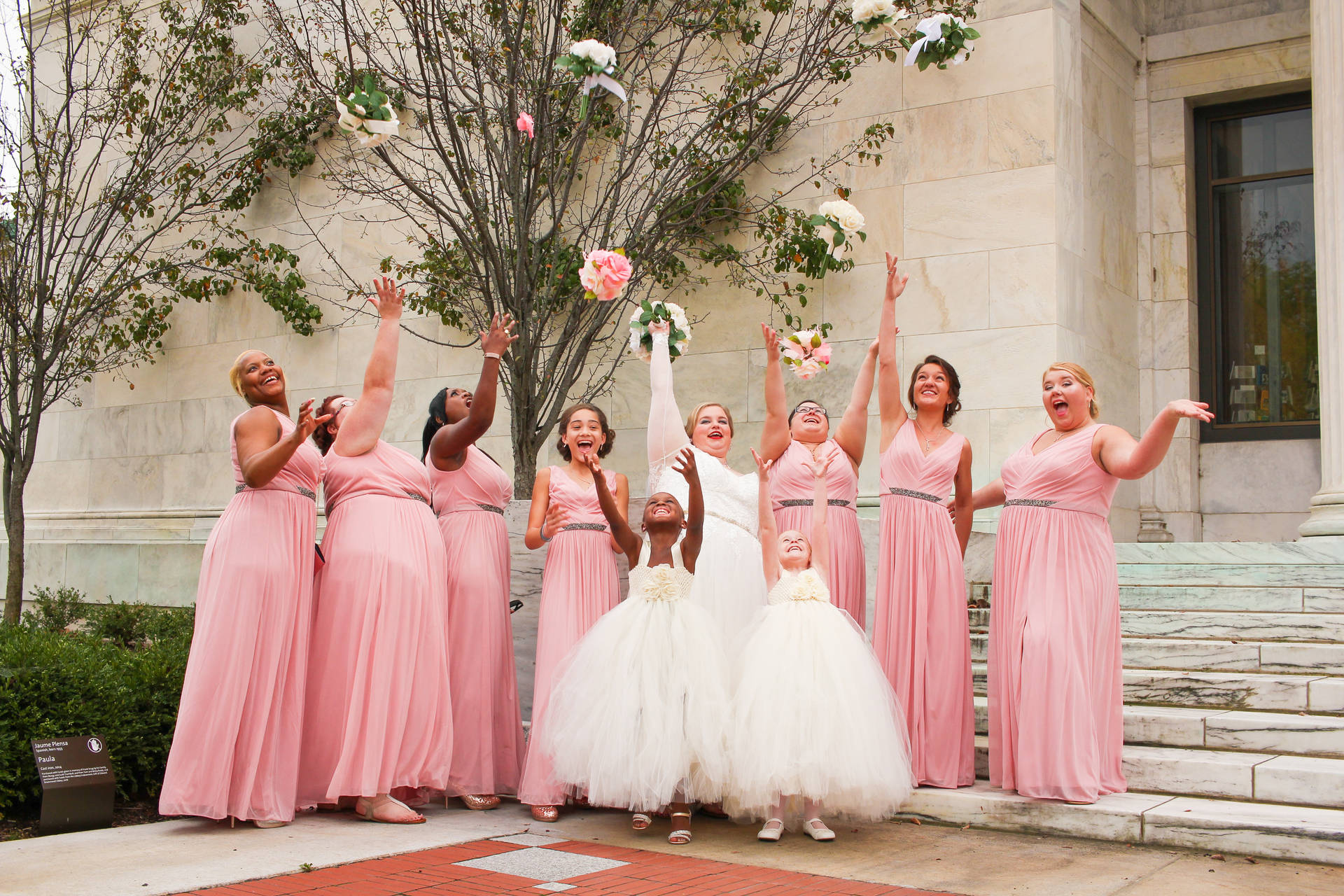 Bridal Party Throwing Their Bouquets Wallpaper