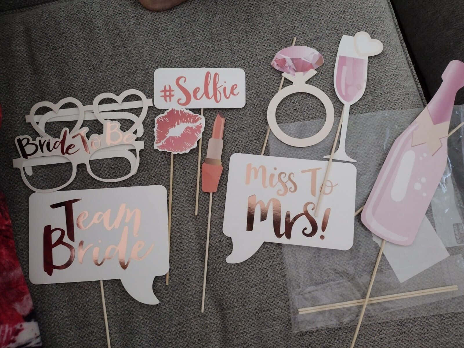 A Group Of Photo Booth Props With Different Words On Them