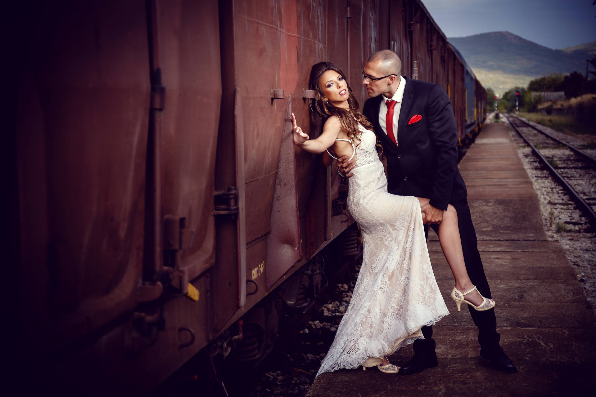 Bride And Groom Beside Train Wallpaper