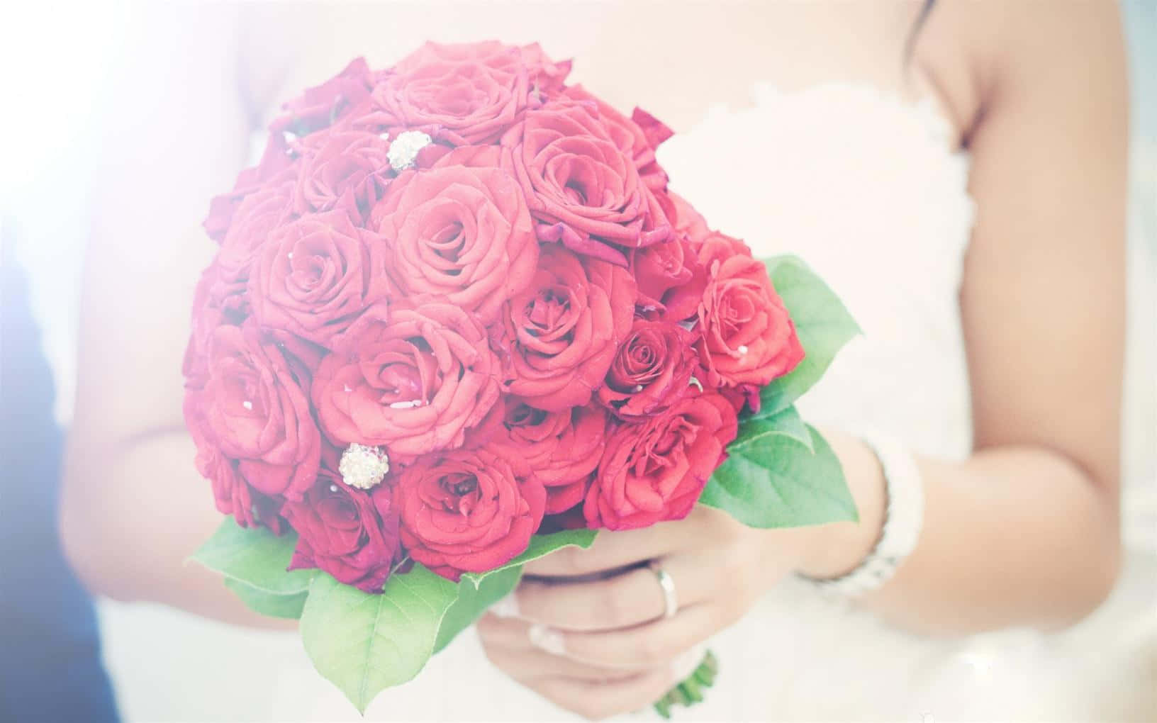 Bride Holding Rose Bouquet Wallpaper