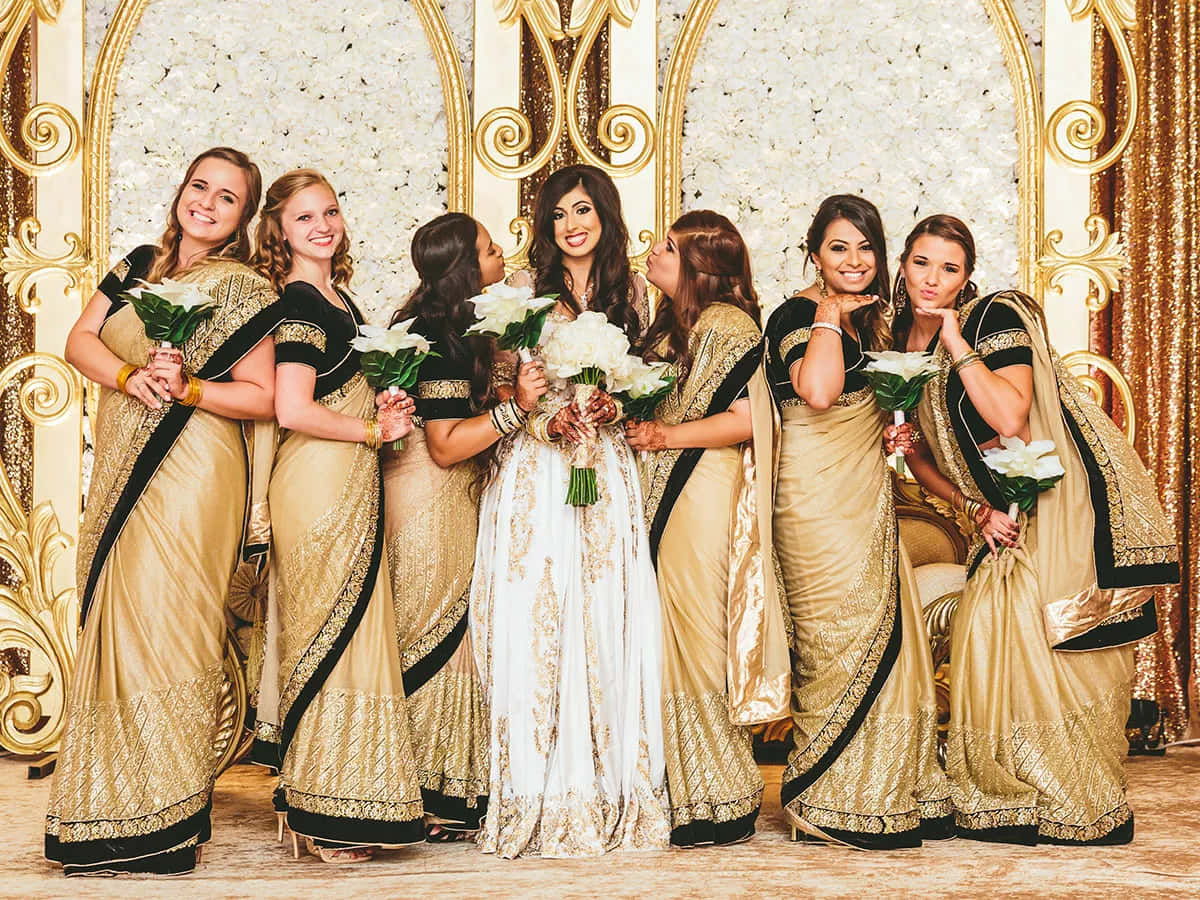 Bride With Six Bridesmaids Wearing Golden Dresses Picture