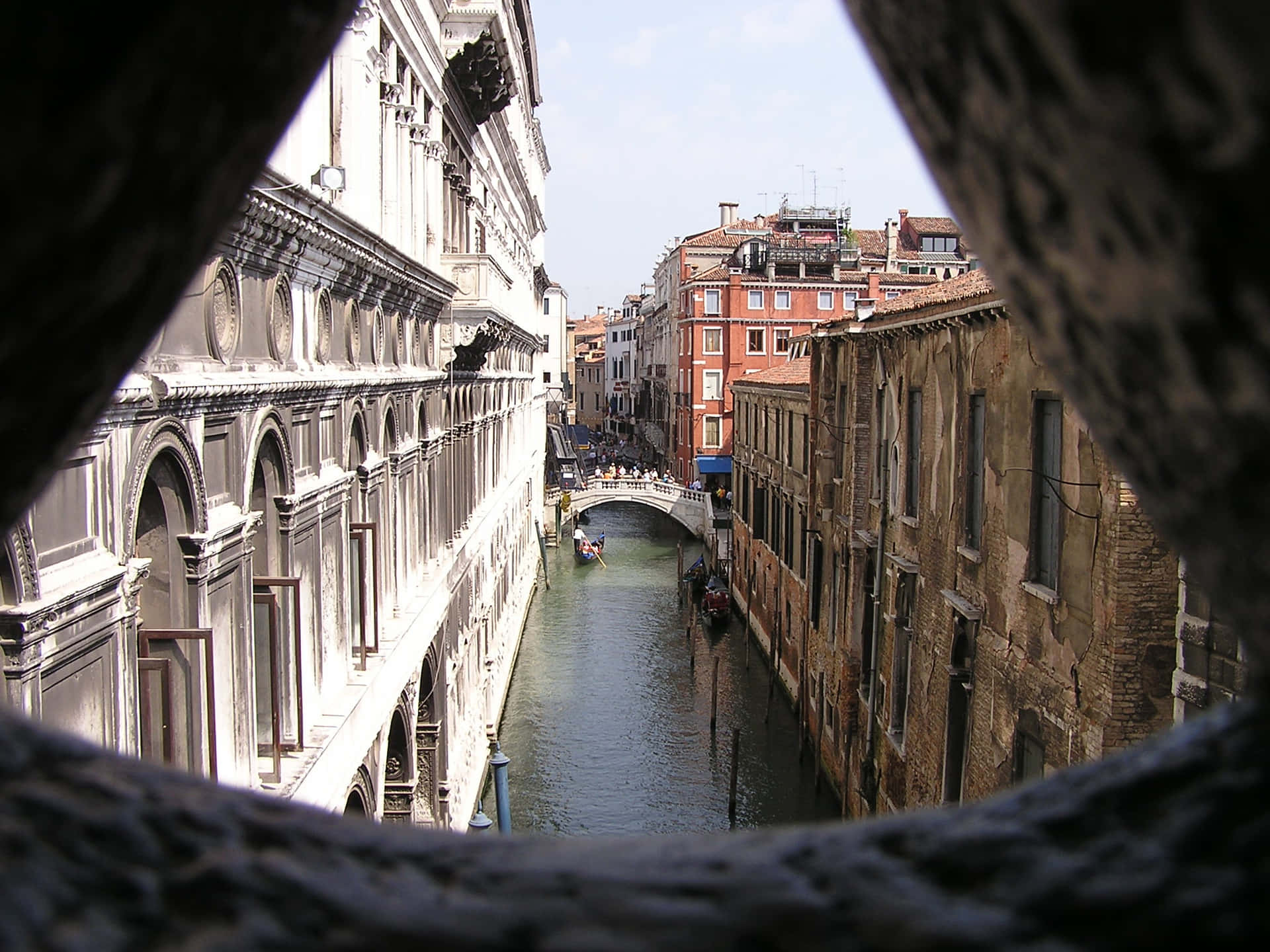 Enchanting View of the Bridge of Sighs Over Serene Venetian Canal Wallpaper