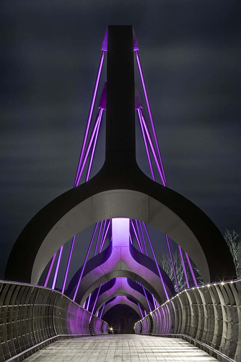 A Bridge With Purple Lights On It
