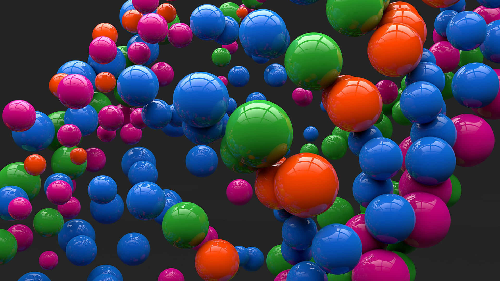 Unmontón De Bolas Coloridas Están Flotando En El Aire. Fondo de pantalla