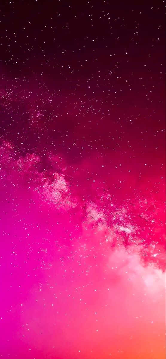 A Pink And Purple Sky With Stars And Stars