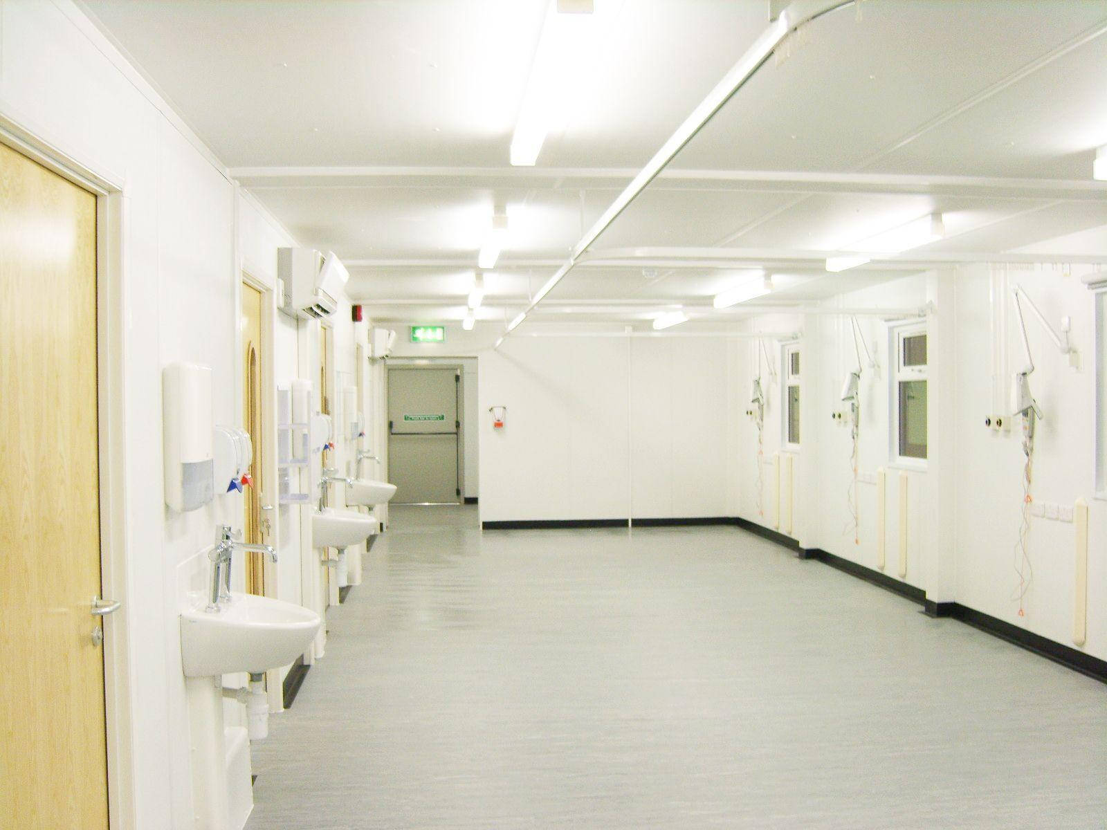 Bright White Hospital Hallway Wallpaper