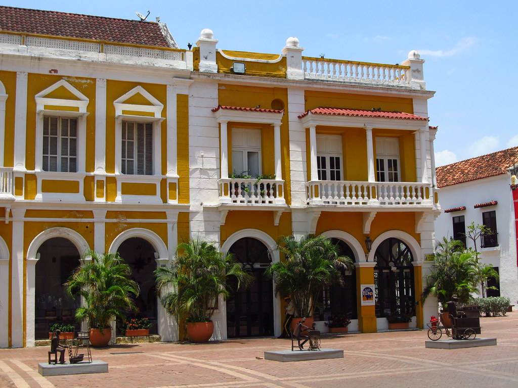 Bright Yellow Building In Cartagena Wallpaper