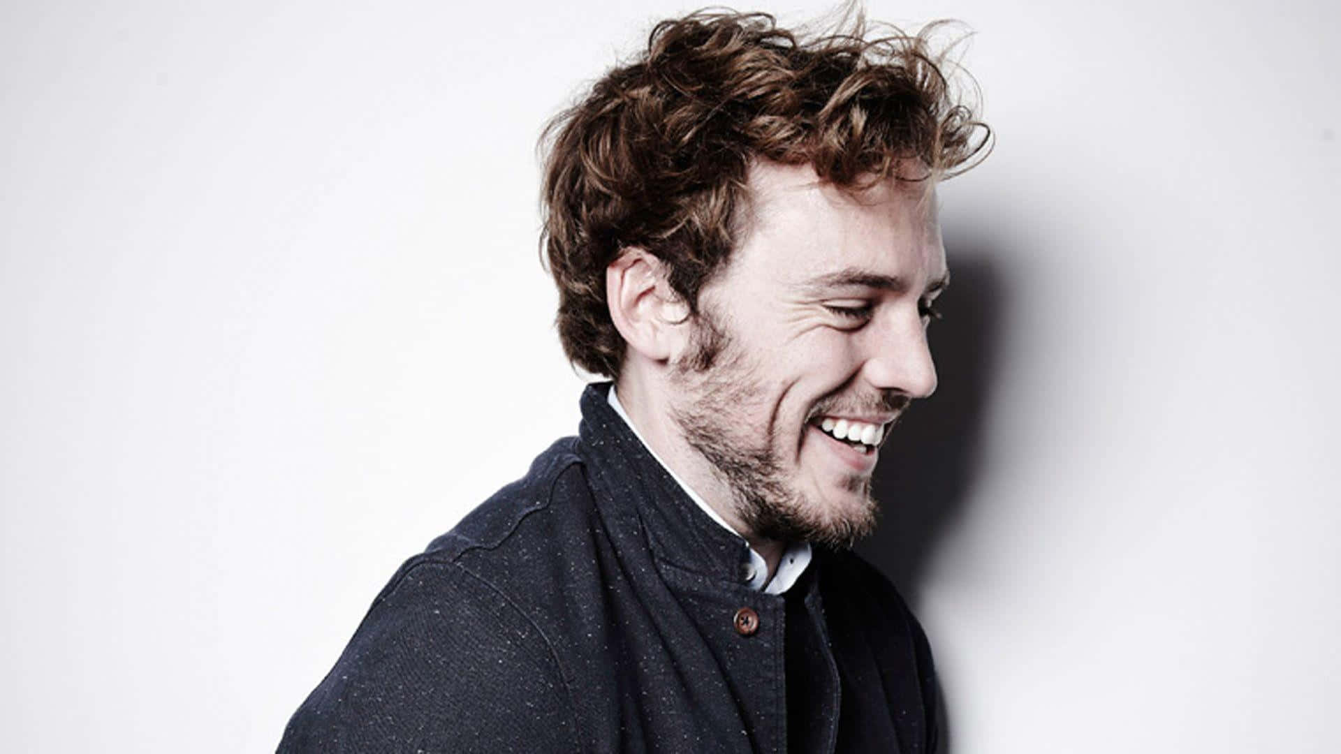 British Actor Sam Claflin Posing On Red Carpet Wallpaper