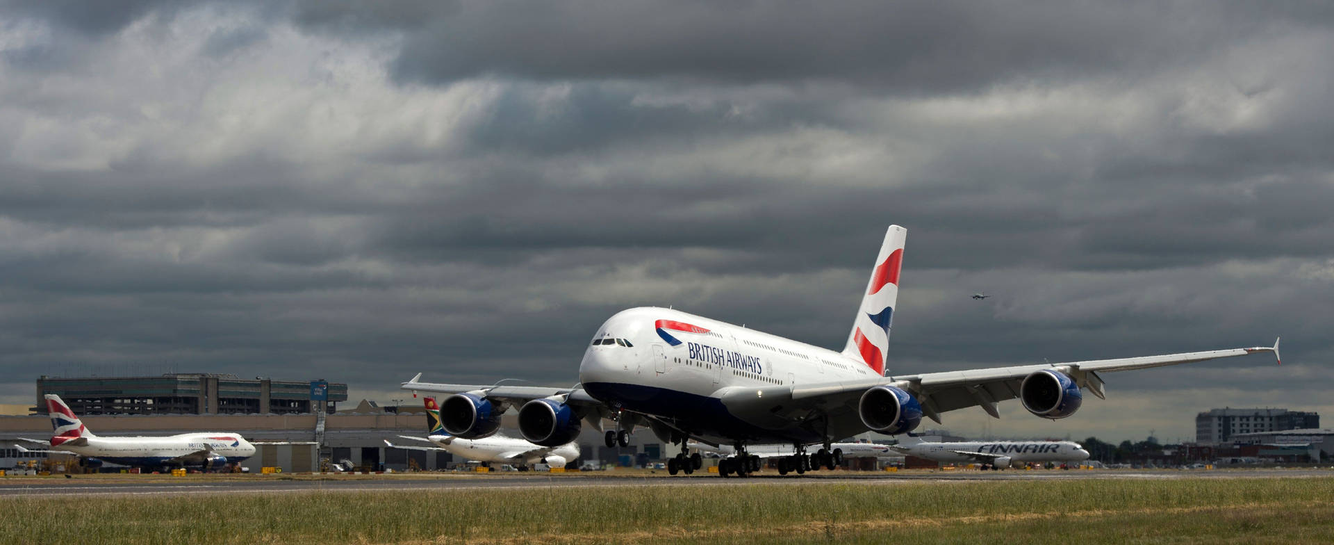 British Airways Runway With Dark Clouds Wallpaper