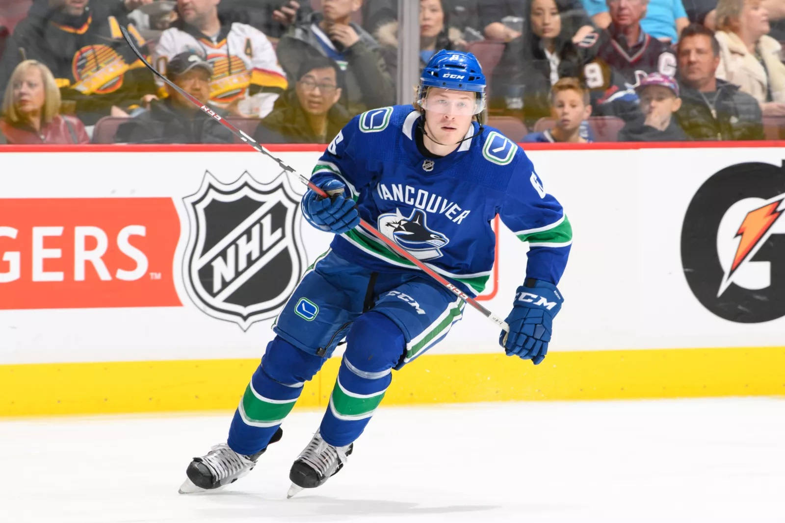 Dynamic and focused Brock Boeser in Action during 2018 NHL Game Wallpaper