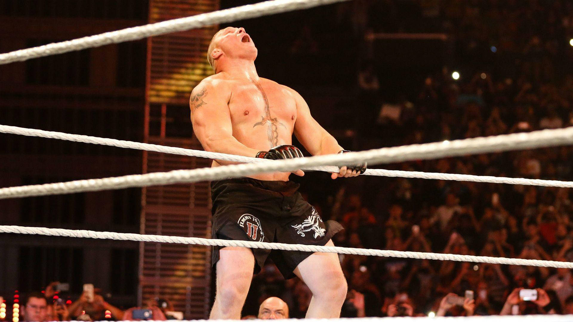Brock Lesnar Dominating the Ring in Full Action Wallpaper