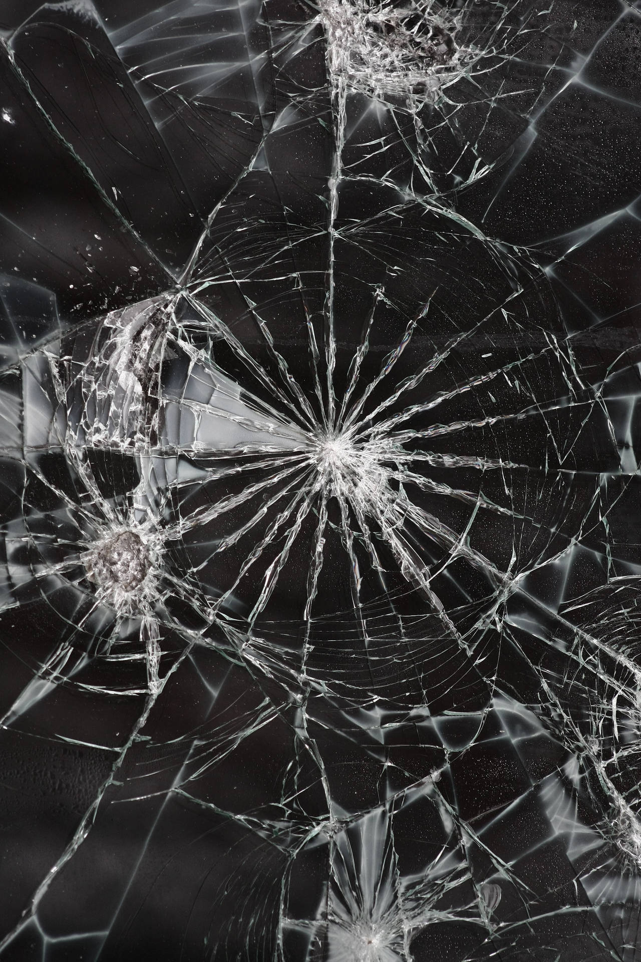 Shattered Illusions: A Broken Glass close-up Wallpaper