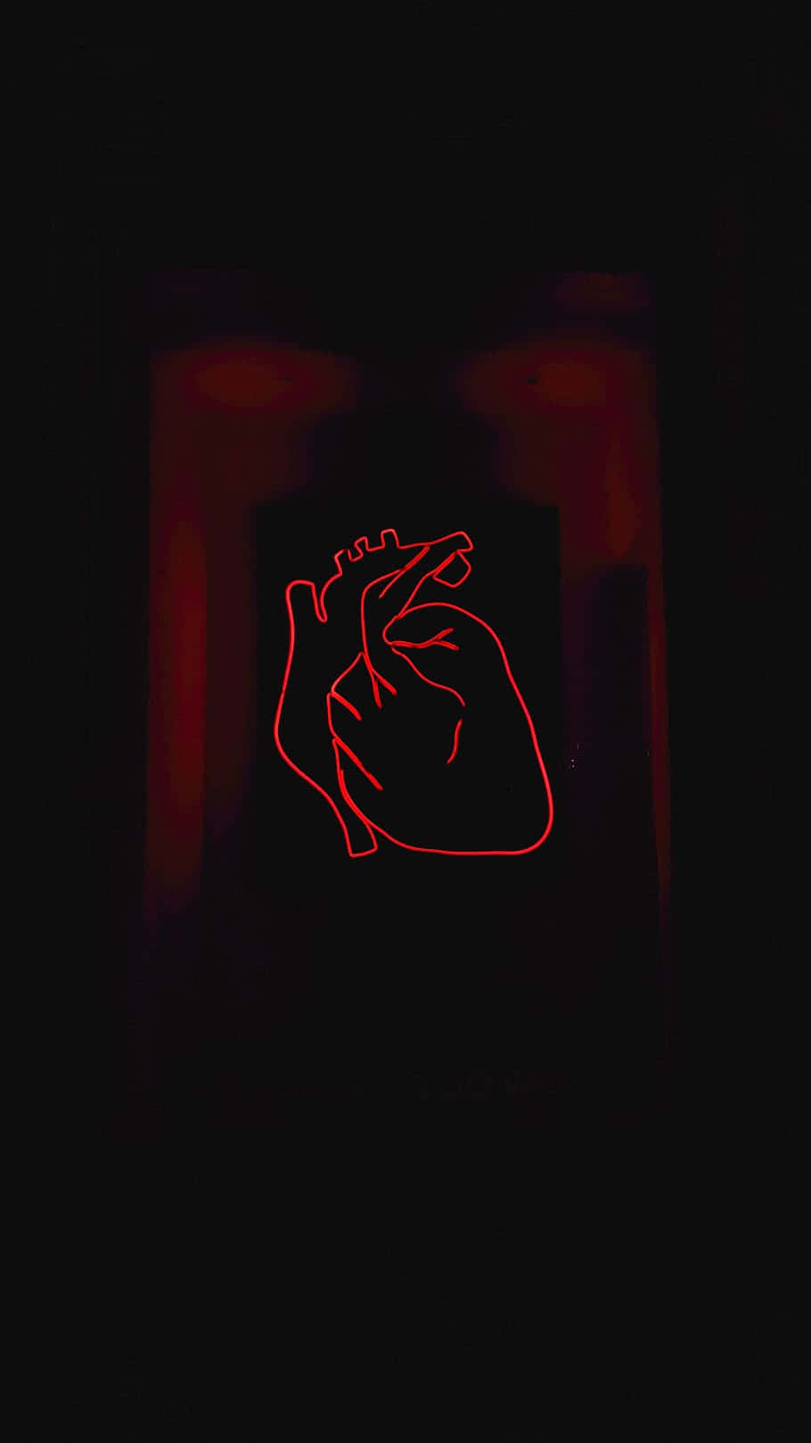 A broken heart symbol against a black background